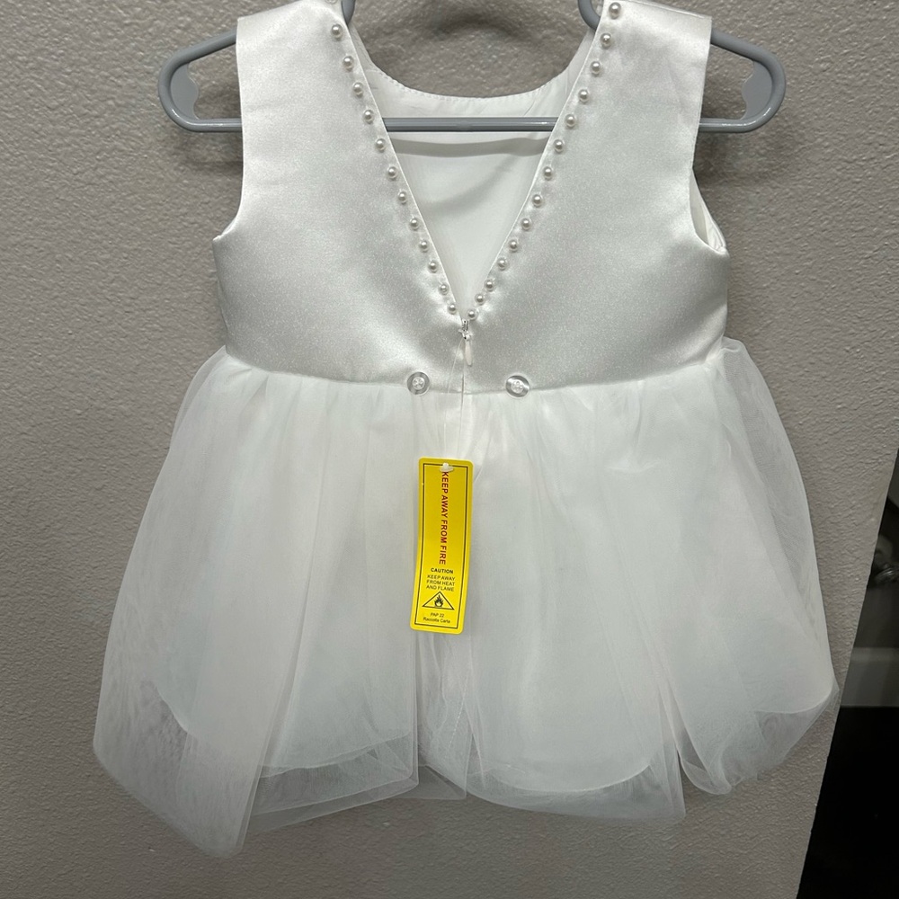 White toddler dress with the pearls